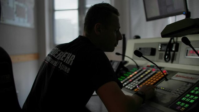 Fire service incident control desk. Officer dealing with request to respond