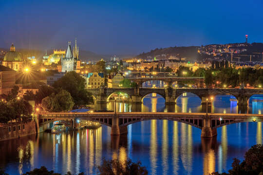 Fototapeta View of Prague with the bridges over the river Vltava at night