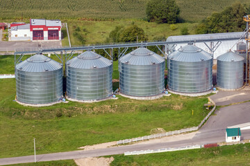 Obraz premium aerial panoramic view on agro-industrial complex with silos and grain drying line