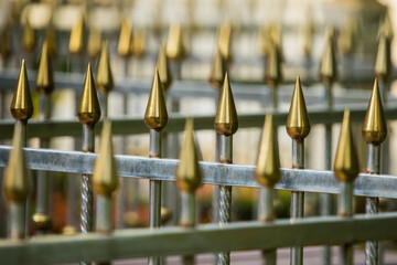 Stainless steel fence, golden arrow, anti-theft spike, arranged in a line