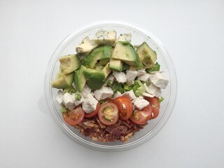 Top view of caesar salad with avocado, tomato, bacon, chicken for healthy dish, brunch, lunch, vegetable meal, restaurant, menu, organic recipe, food background, wallpaper, backdrop, food delivery, ad