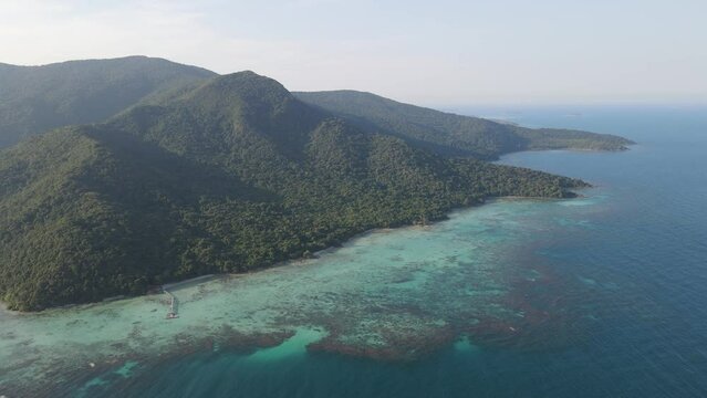 Aerial view of tropical forest in Karimunjawa island, Indonesia, above trees and nature forest top down view