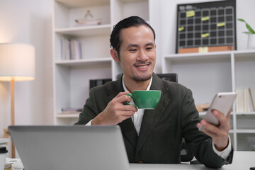 Close up of happy smile businessman holding smartphone in office for online chat message communication. Using mobile phone in workplace electronic transactions, shopping online. Focus at mobilephone.