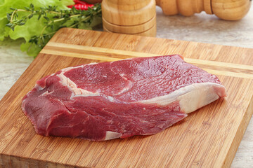 Raw rib-eye beef steak black angus