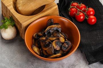Roasted champignon mushrooms in the bowl