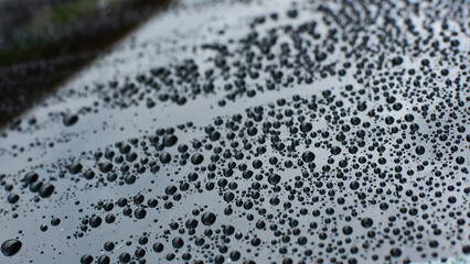 rain raindrops on the floor of car paint.