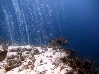 underwater bubbles while a scuba dive at canyon dive site in egypt