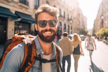 Foto op Plexiglas Portrait of happy handsome hipster man with backpack in Spanish city. Solo traveling, digital nomads lifestyle. Young tourist enjoy holiday vacation in sunny day © vejaa
