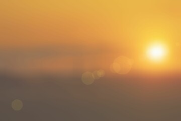 Soft, blurred background with round, glowing lights of the picturesque orange sunset