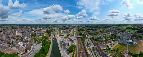 Halle, Flemish Brabant Region, Belgium, 01 05 2023, aerial panorama view of the railway station and the sea canal in the city of Halle on a sunny spring day. High quality photo. High quality photo