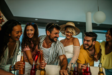 A dynamic group of friends, joins a spirited daytime event, carrying an assortment of delectable food and refreshing beverages