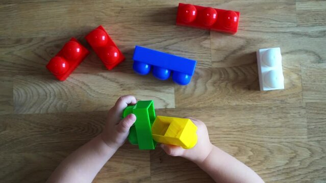 Child development. Montessori toy blocks and a child, a baby playing. Early development, kindergarten, childhood concept.