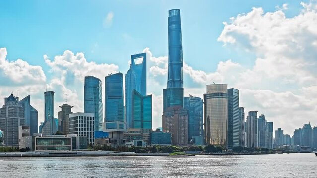 Time-lapse Shanghai city financial district skyline at sunrise. Removed building trademark and advertising