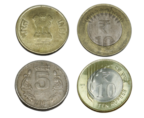 five rupees coin, and ten rupees coins. on white background. Rupees, Indian Currency coins money, business real estate concept.
