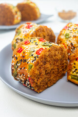 roti gulung abon or floss roll bread. contains shredded meat topped with sesame, spring onions and chili.