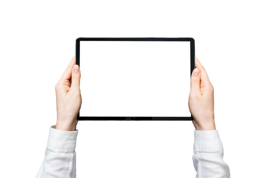 Close up image woman hands holding digital tablet with blank copy space screen for your text message or promotional content om table with cup of coffee. hands of a woman holding blank tablet device