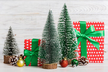 Christmas composition. craft Gift box, small tree, branches and craft DIY decorations on white background. New year concept. Christmas home decoration Flat lay, top view, copy space