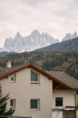 Fototapeta na wymiar Old house in the European Alps. Dolomites mountains.