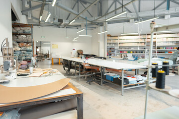 Interior of a sewing warehouse of furniture factory with equipment and materials