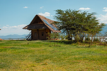 Fototapeta premium Cabins at a campsite at Lake Jipe at Kenya Tanzania border seen from Tsavo West National Park, Kenya