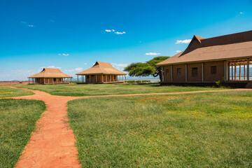 Cabins at a campsite at Lake Jipe at Kenya Tanzania border seen from Tsavo West National Park, Kenya