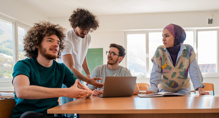A group of diverse college students studying together or young business team working on a project...