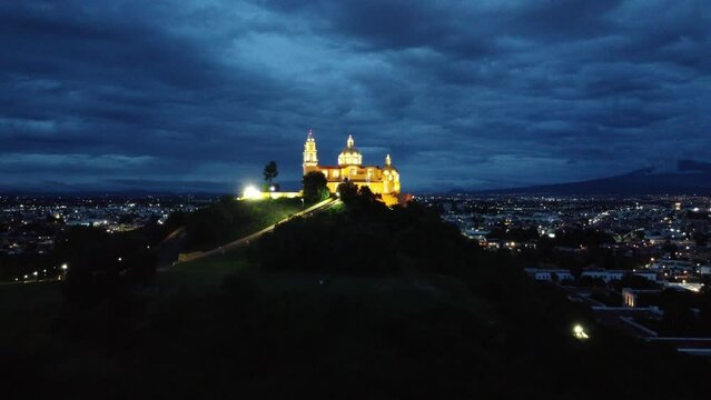 Church Cholula Puebla Mexico Night iglesia Santuario de la Virgen de los Remedios on Pyramid drone View night day Timelapse Cempasuchil Fields