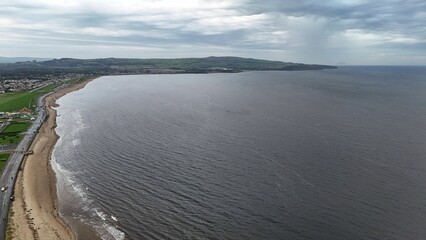 Aerial view of the coastline of Ayr, Scotland with blue waters