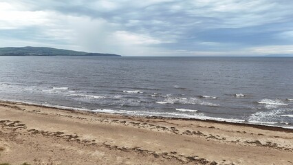 Ayr beach in Scotland against a cloudy sky