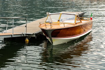 Old wooden motorboat on Lake Como in Italy

