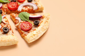Tasty pizza with basil and tomatoes on beige background