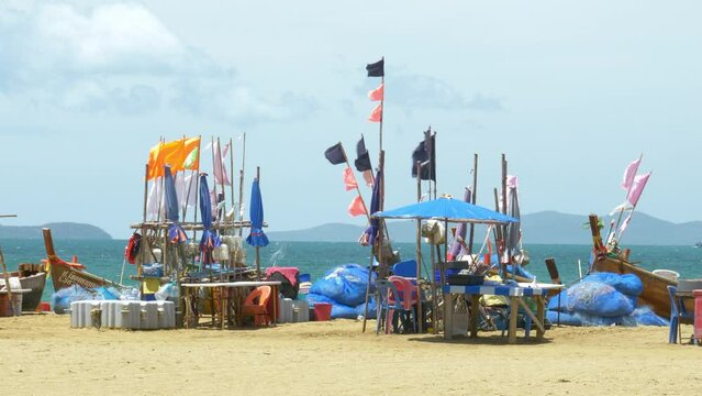 Fishing boats docked at a beachfront facing the Gulf of Thailand in Pattaya, Chonburi province in Thailand.