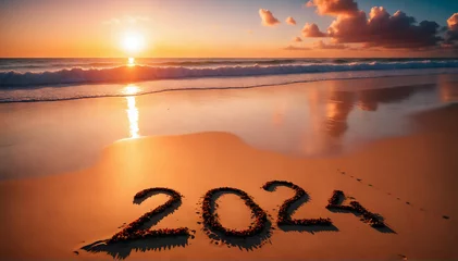 Foto auf Acrylglas A vibrant sunset over a serene beach, with "2024" handwritten in the sand. © Kai Köpke