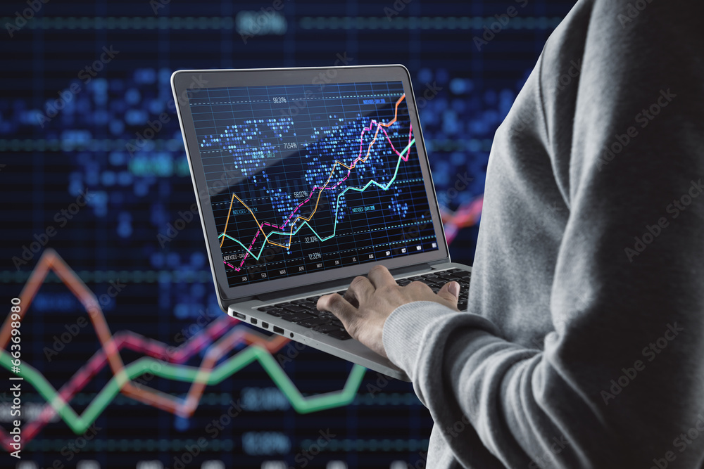 Poster Close up of hacker hands using laptop with glowing downward red forex chart on blurry dark background with index grid. Crisis, hacking and stock market fall concept.