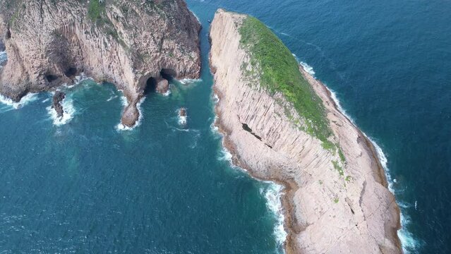 a hexagonal columns landscape in Hong Kong Geopark, at Sai Kung of Po Pin Chau island
