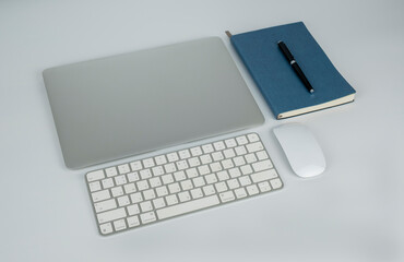 office white laptop booknote pen keyboard and mouse