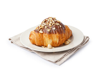 Plate of tasty sweet croissant with chocolate and nuts isolated on white background