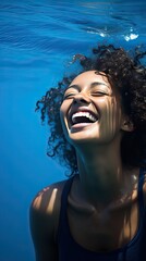 Ocean Ease: A relaxed shot where the model is captured mid-laugh, giving a carefree vibe against a calming deep blue background