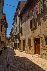 Fototapeta na wymiar A quiet back street in the historic centre of the medieval coastal town of Rovinj in Istria, Croatia