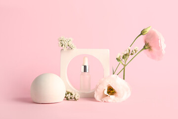 Composition with bottle of essential oil, plaster podium and beautiful flowers on pink background