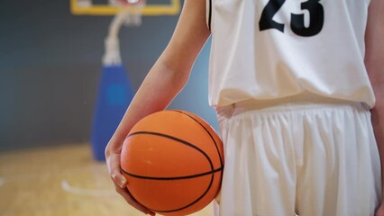 Slow motion, woman basketball player, holds a ball in his hands, basketball championship, woman power. - Powered by Adobe