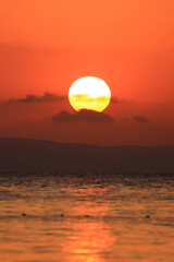 Sun at sunset, warm colors, view from the beach on Island Murter, Adriatic sea, Croatia