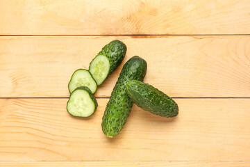 Fresh cucumbers on wooden background