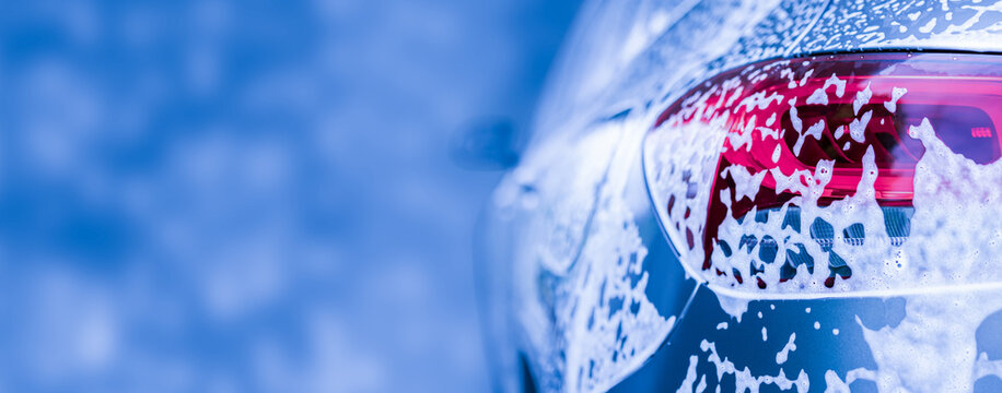 car cleaning and washing with foam soap background