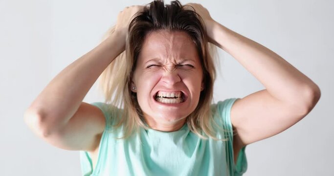 Portrait of angry emotionally nervous screaming woman. Hatred and psychological emotional female breakdown concept