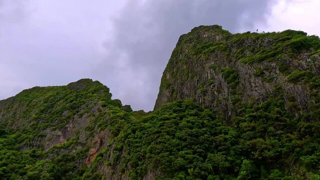 Phi Phi island off the coast of phuket thailand. Phi phi island is famous for turquoise clear blue waters teaming with Corel reef fish white soft sand and lush green trees.