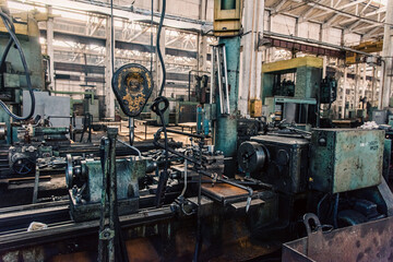 Fototapeta na wymiar Old equipment, machines, tools in a rustic style in an abandoned mechanical factory