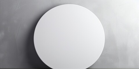 A white round frame for mockup on a plain gray wall