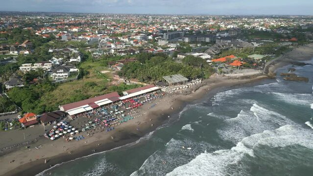Drone aerial view over Megan beach in Canggu, Bali