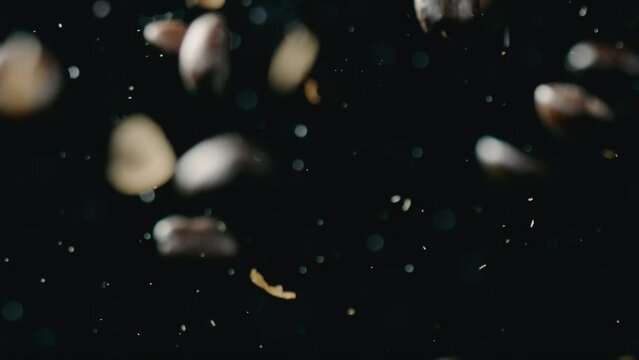 Coffee beans fall down and a fire blazes in the background